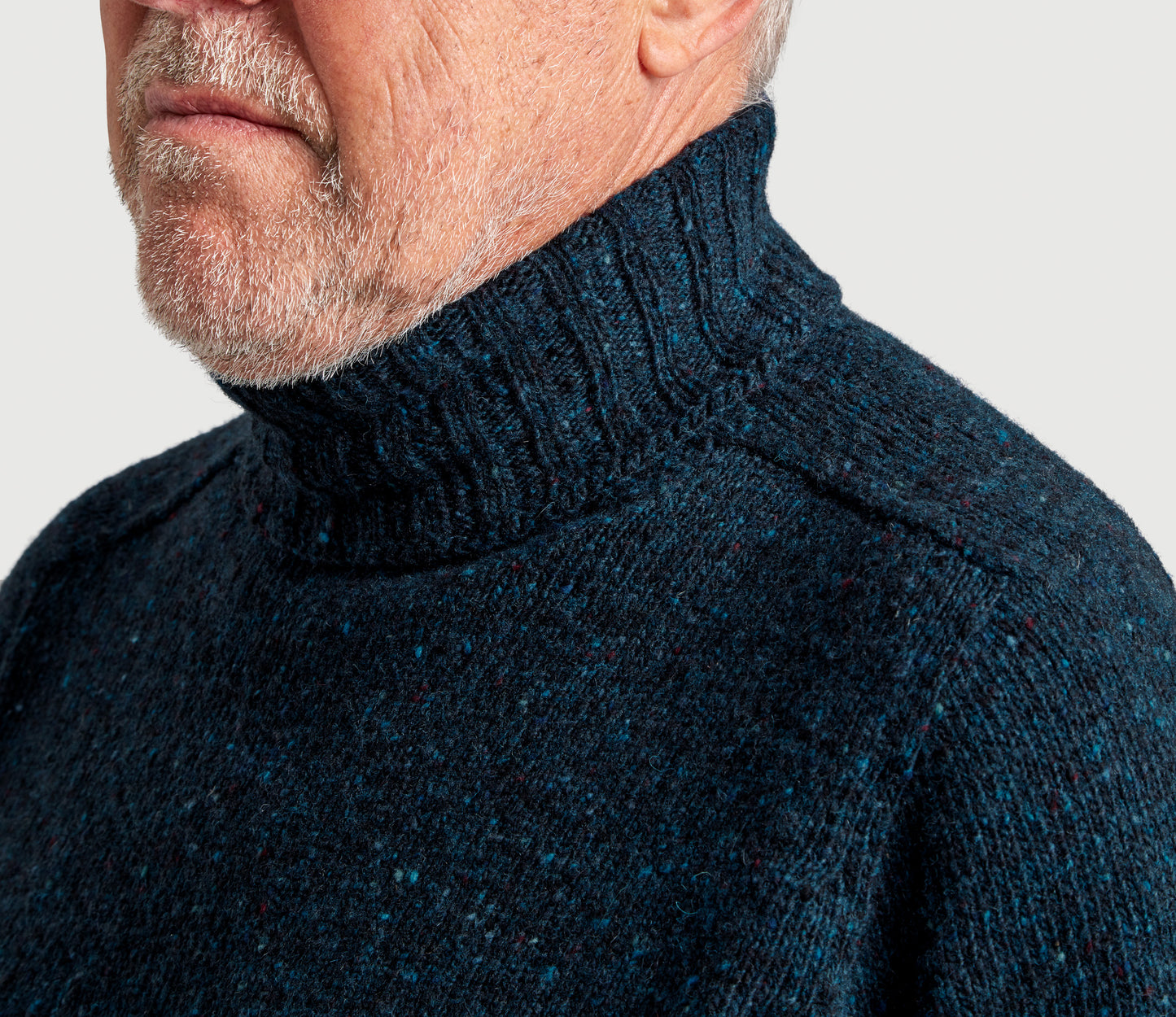 Merino Wool Donegal Roll Neck Jumper in Petrol Tweed